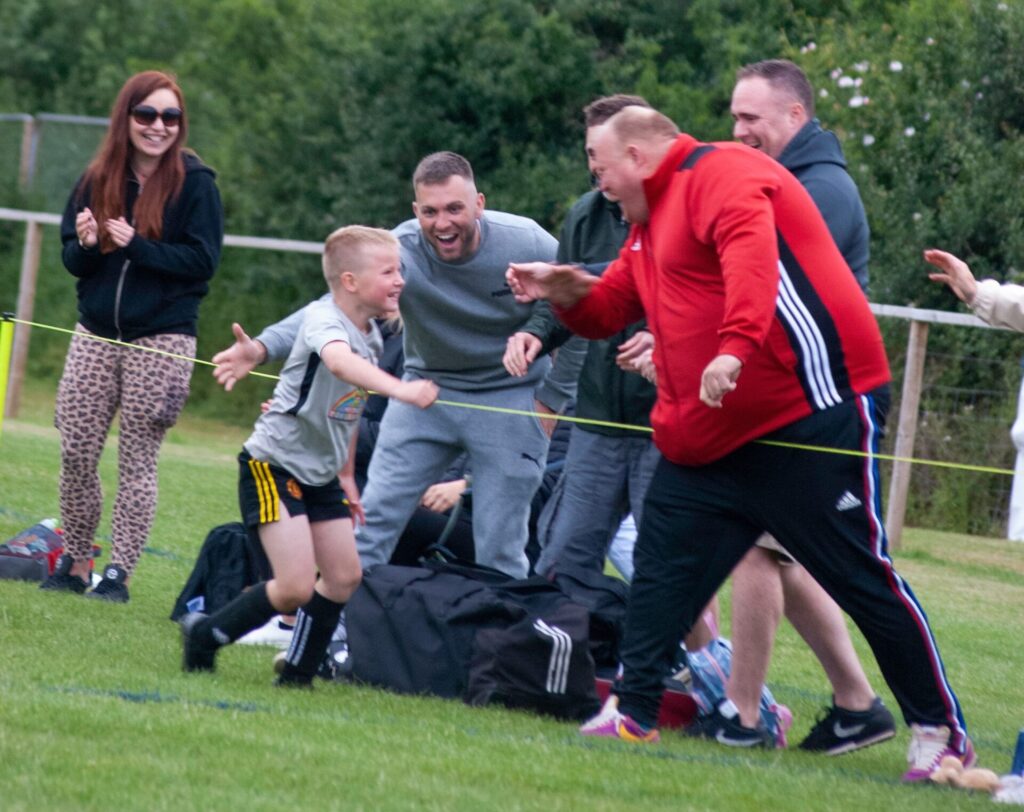 Leek U8's celebrate scoring at the New Tupton Ivanhoe Summer Festival of Football