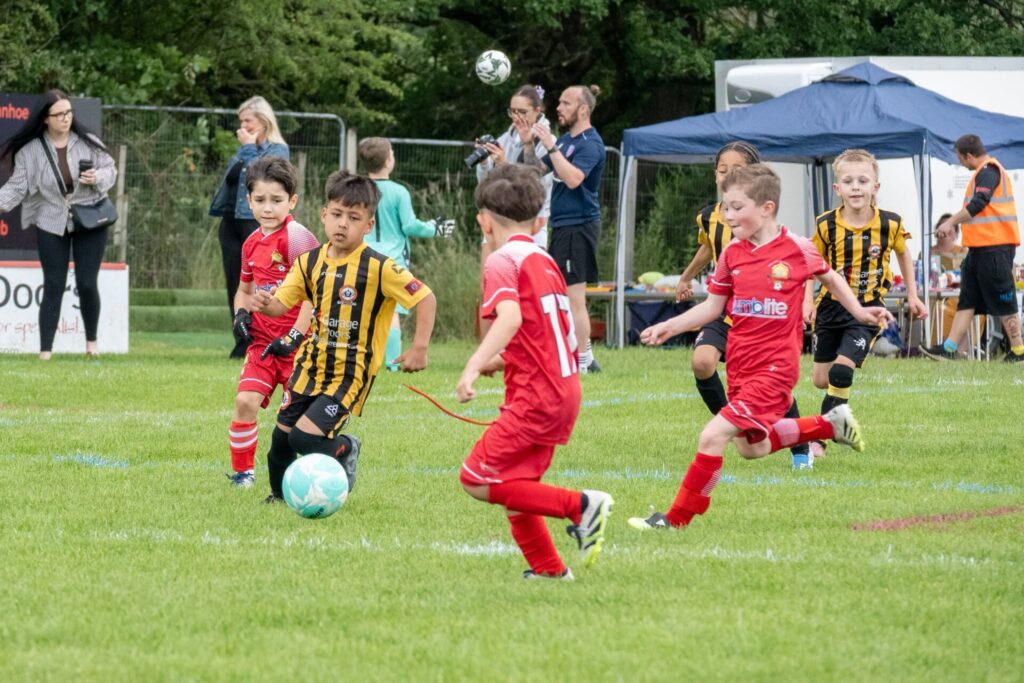 Player running with the ball at the New Tupton Ivanhoe Summer Festival of Football.
